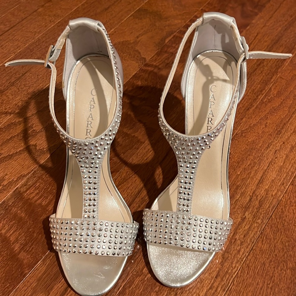 Silver Caparros Heels brand new. True to size. Box not available.